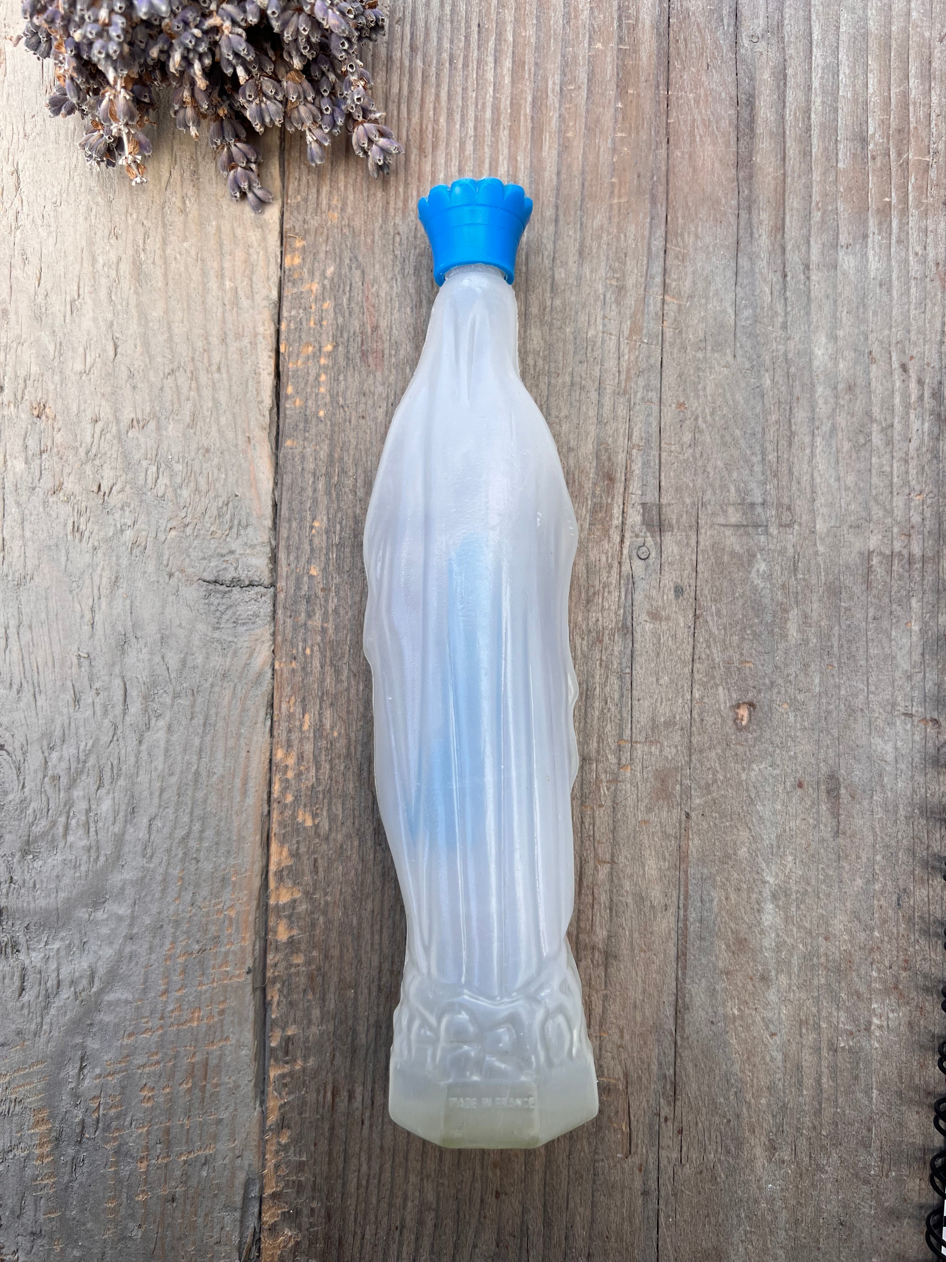 Empty holy water bottle Maria de Lourdes