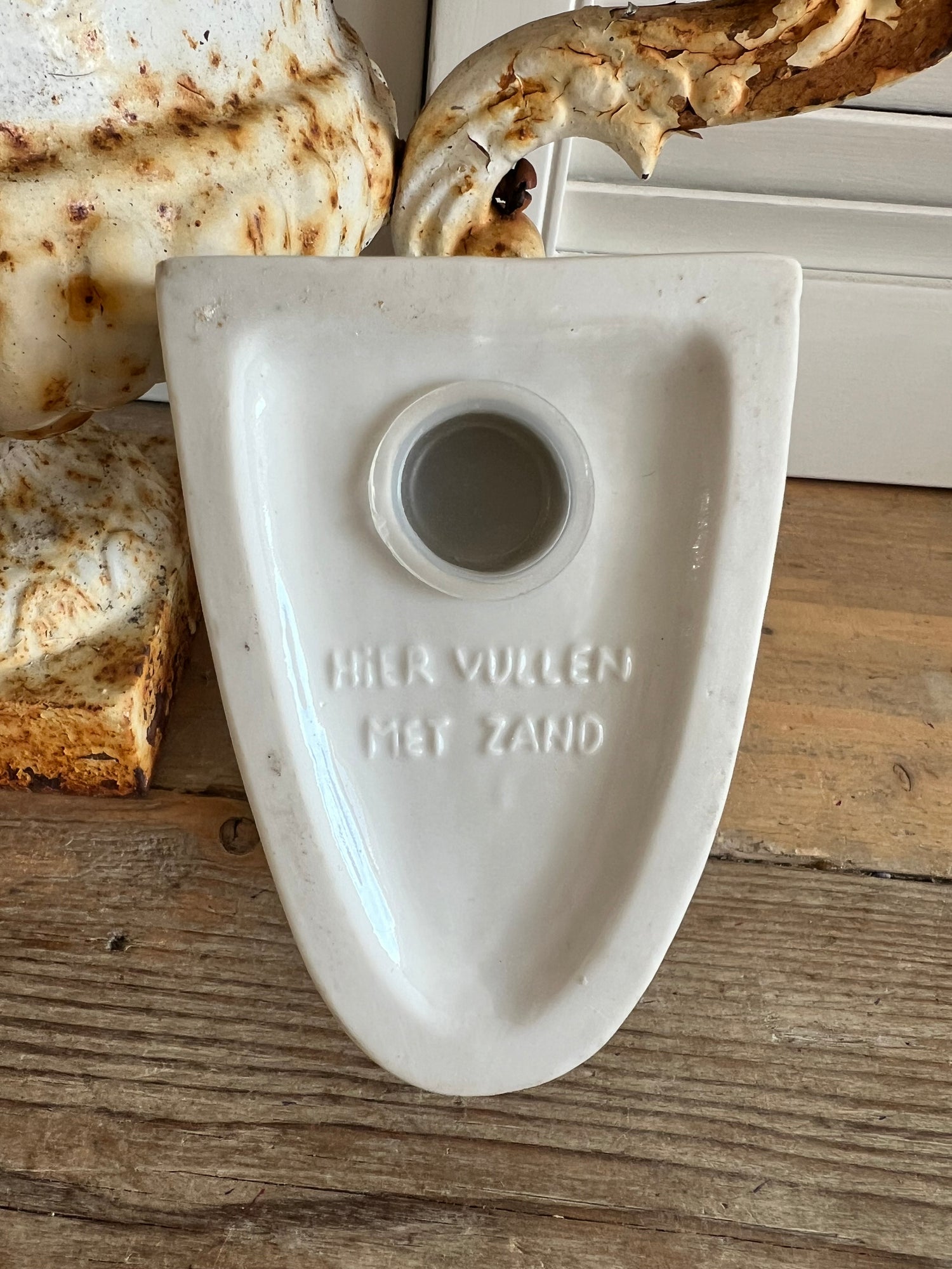 Boekensteun in de vorm van een eendenhoofd
