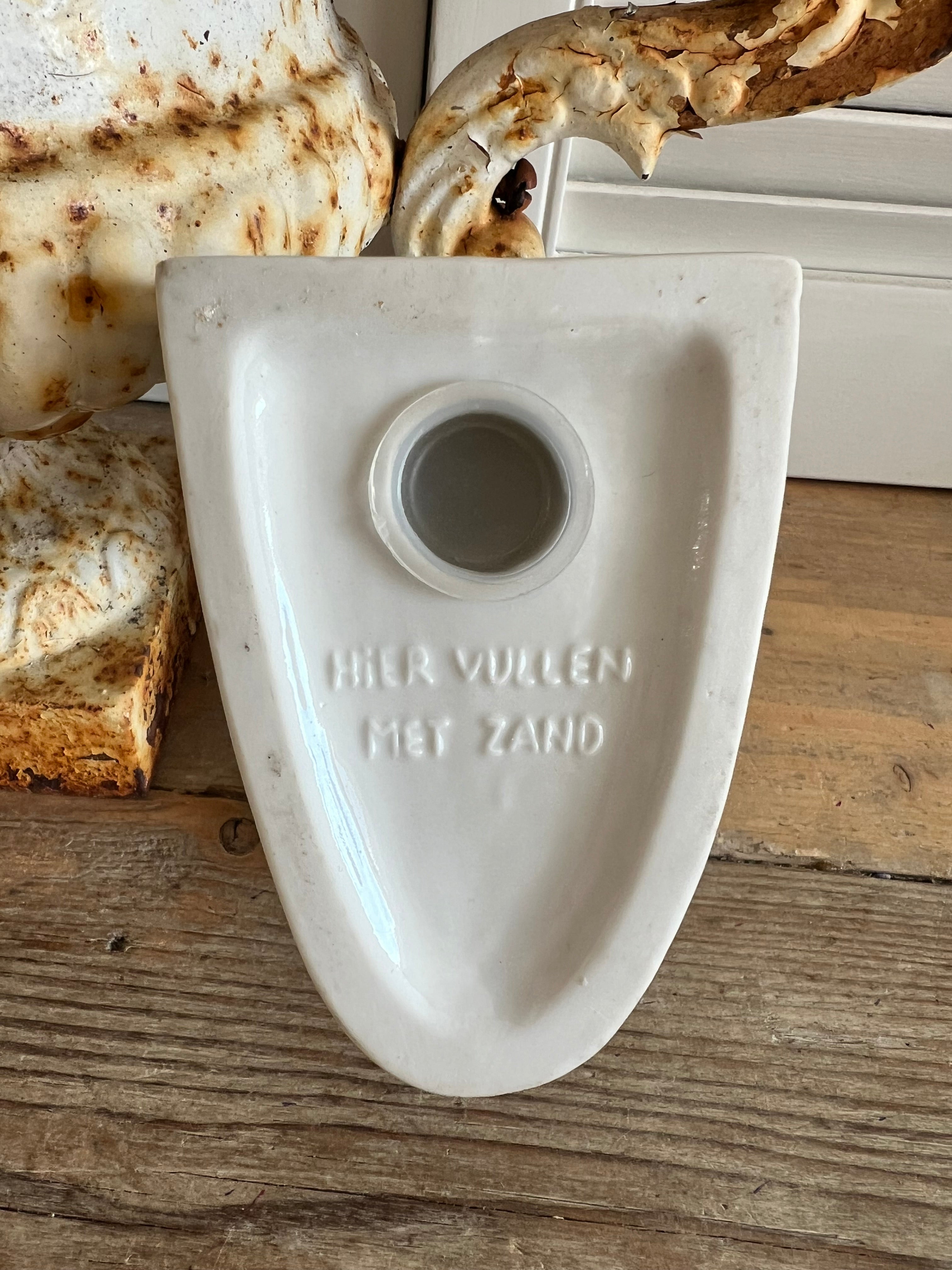 Boekensteun in de vorm van een eendenhoofd