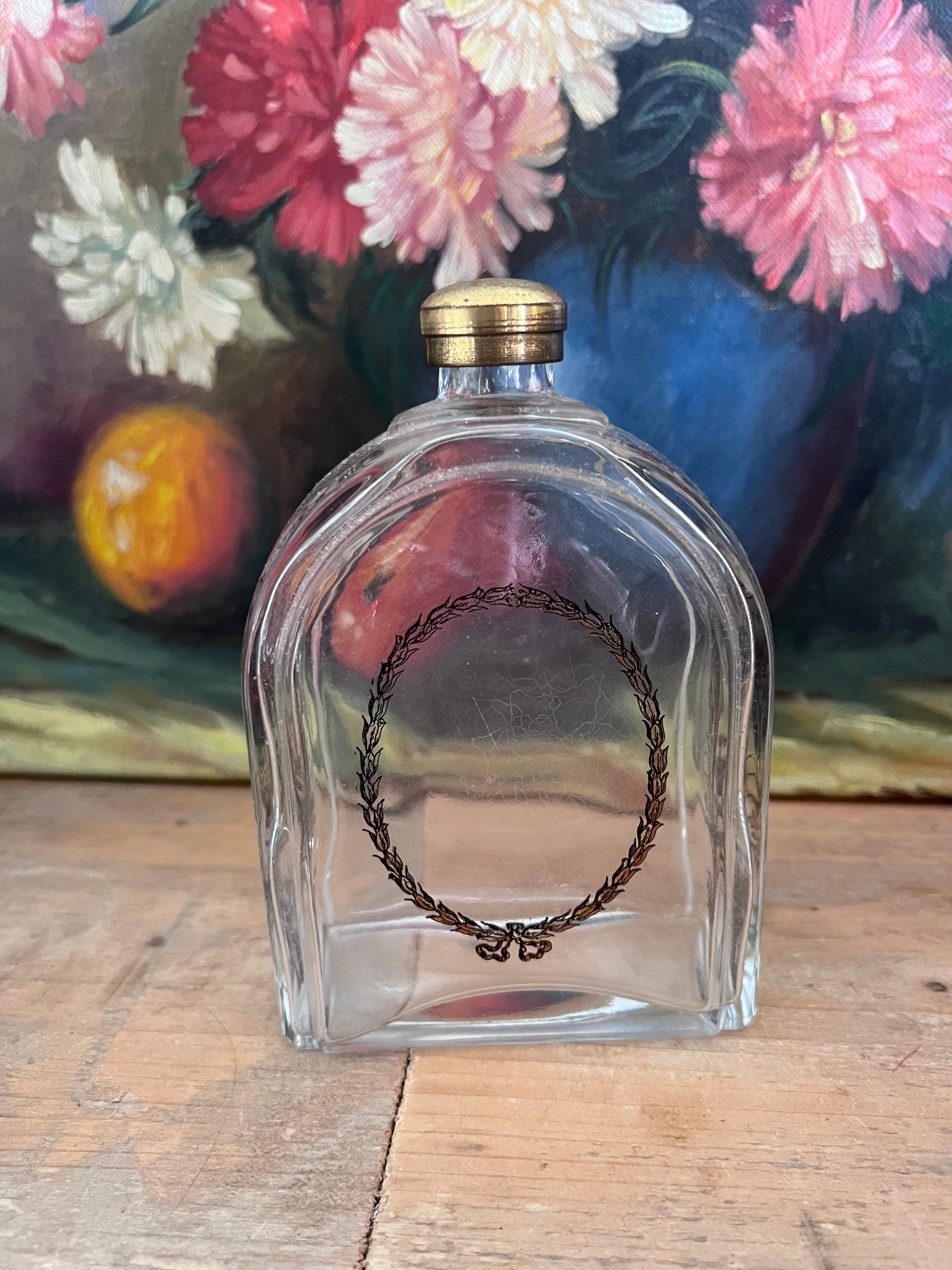 Vintage eau de cologne fles met print en schroefdop
