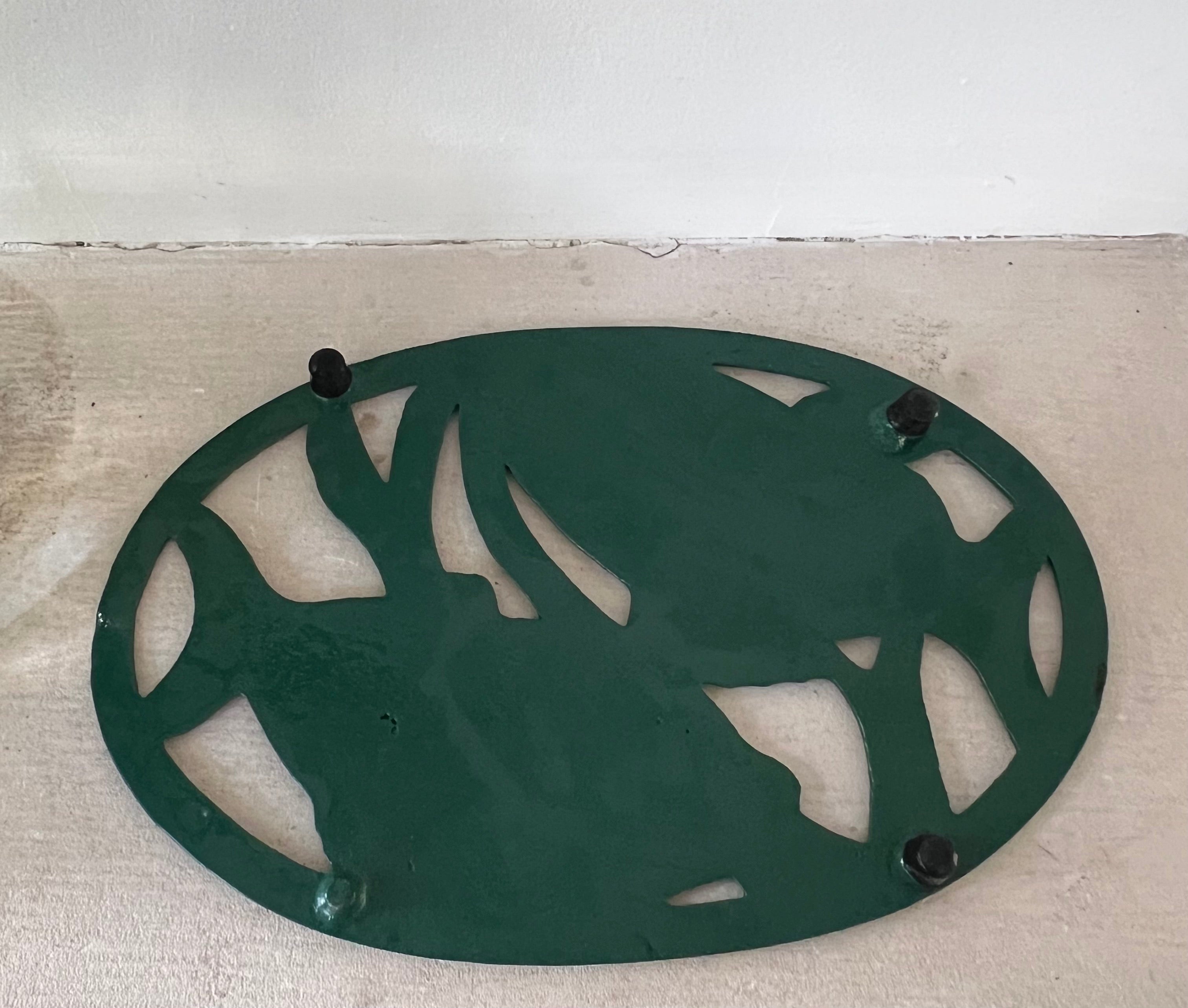 gietijzeren pannenonderzetter, pannenonderzetter vissen, decoratieve pannenonderzetter, hittebestendige pannenonderzetter, stevige pannenonderzetter gietijzer.