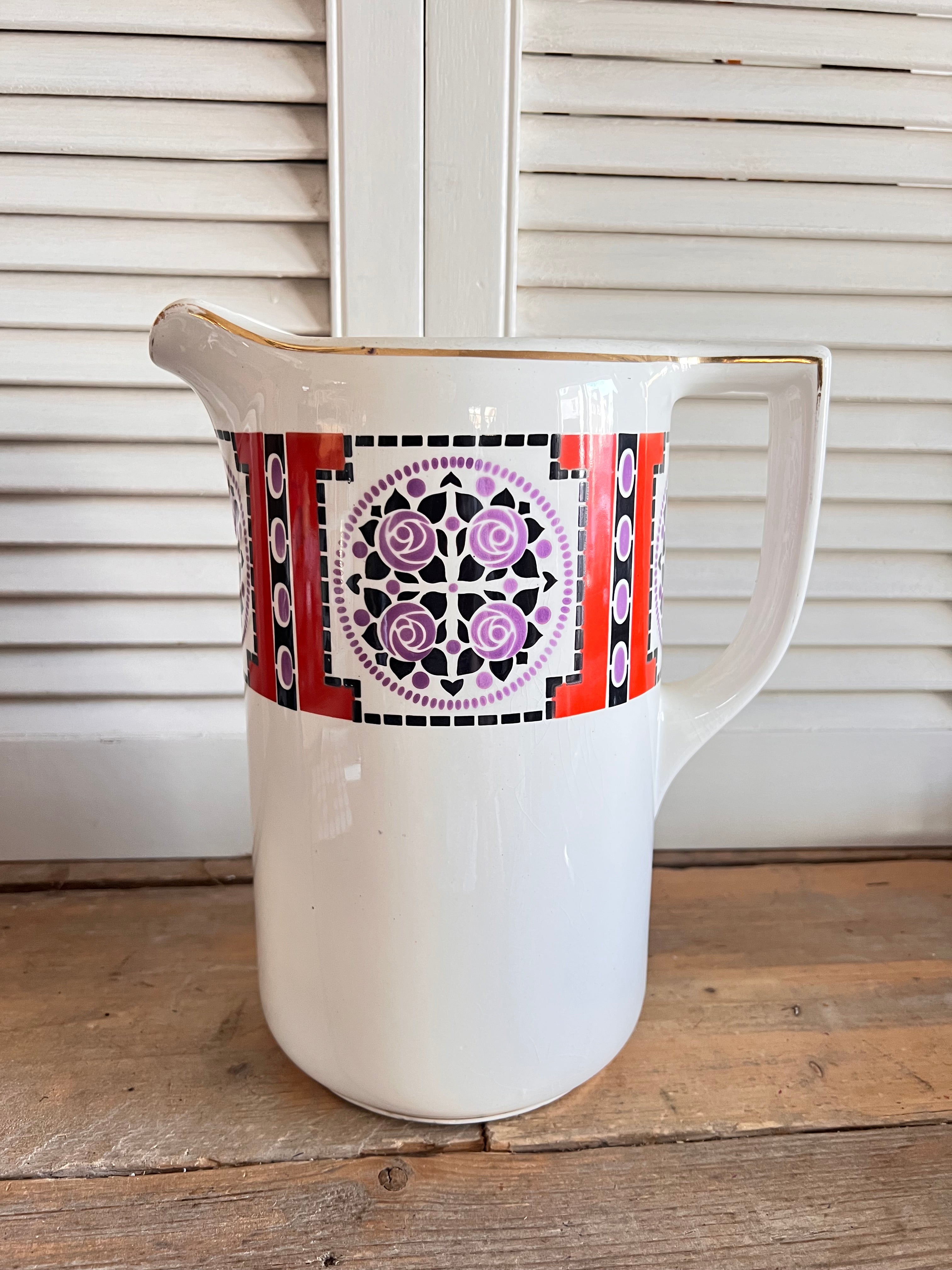 Art Deco keramiek, Societe Ceramique Maastricht, vintage keramieken kan, rozenmotief keramiek, paars zwart oranje kan, Nederlands aardewerk, decoratieve kan, design object keramiek.