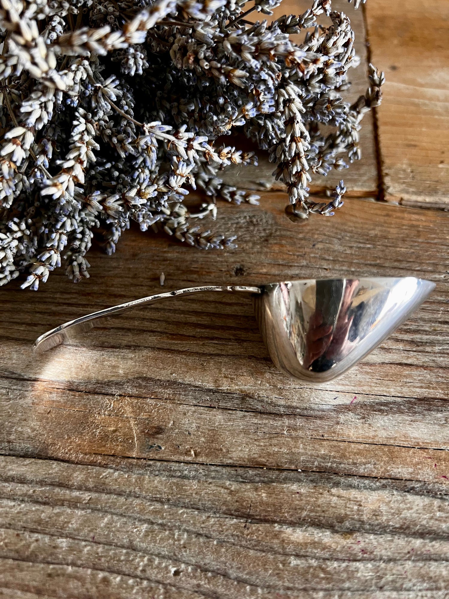 Verzilverde koffieschep Douwe Egberts