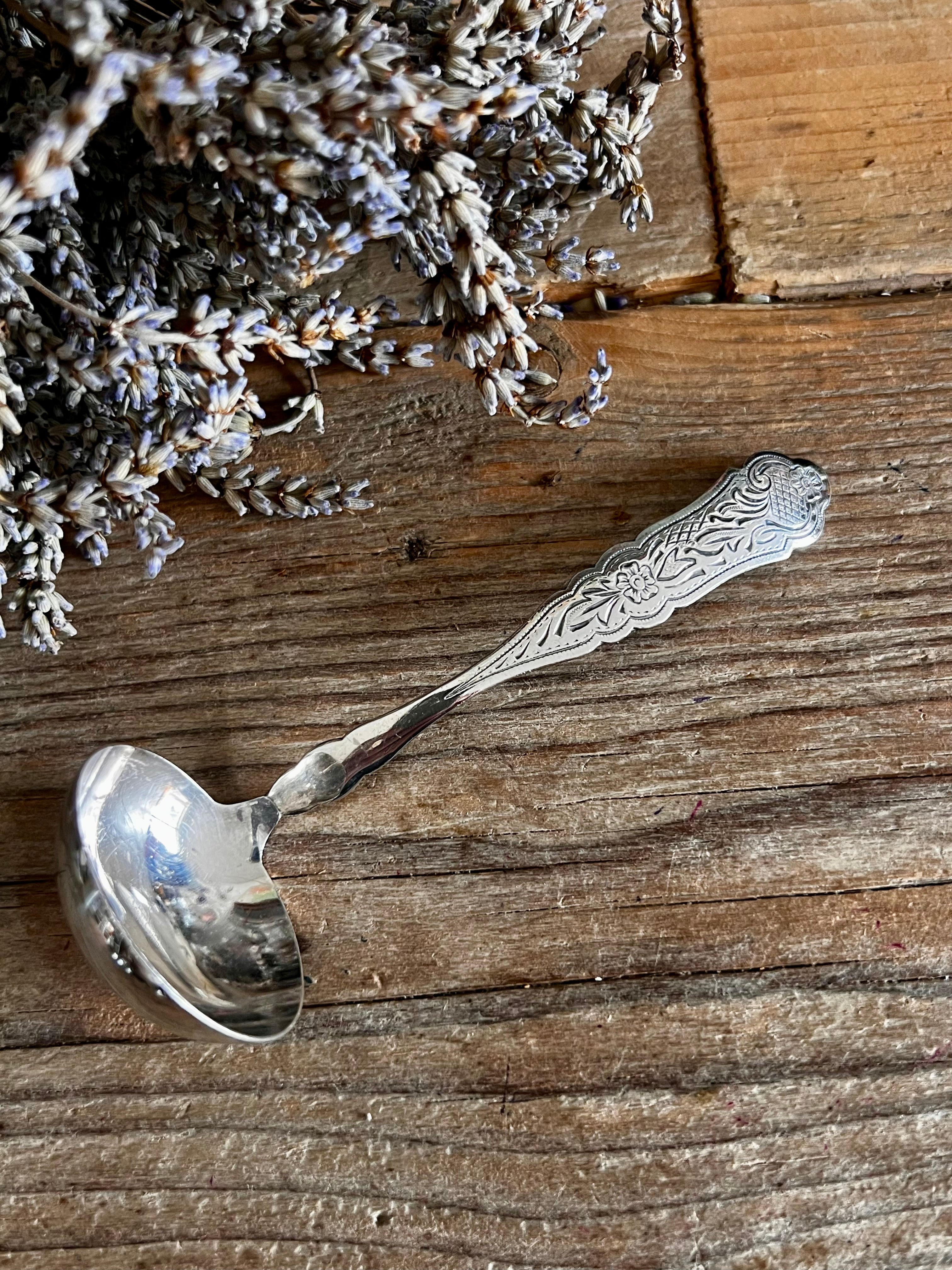 Roomlepel Douwe Egberts verzilverd H. Hooijkaas