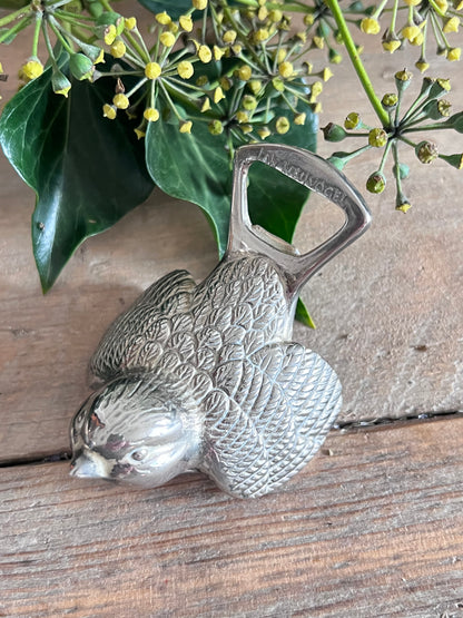 Jam Meuvogel flesopener, zilverkleurige flesopener, vintage flesopener, retro flesopener, metalen flesopener, flesopener vintage stijl, unieke flesopener, Jam Meuvogel opener.