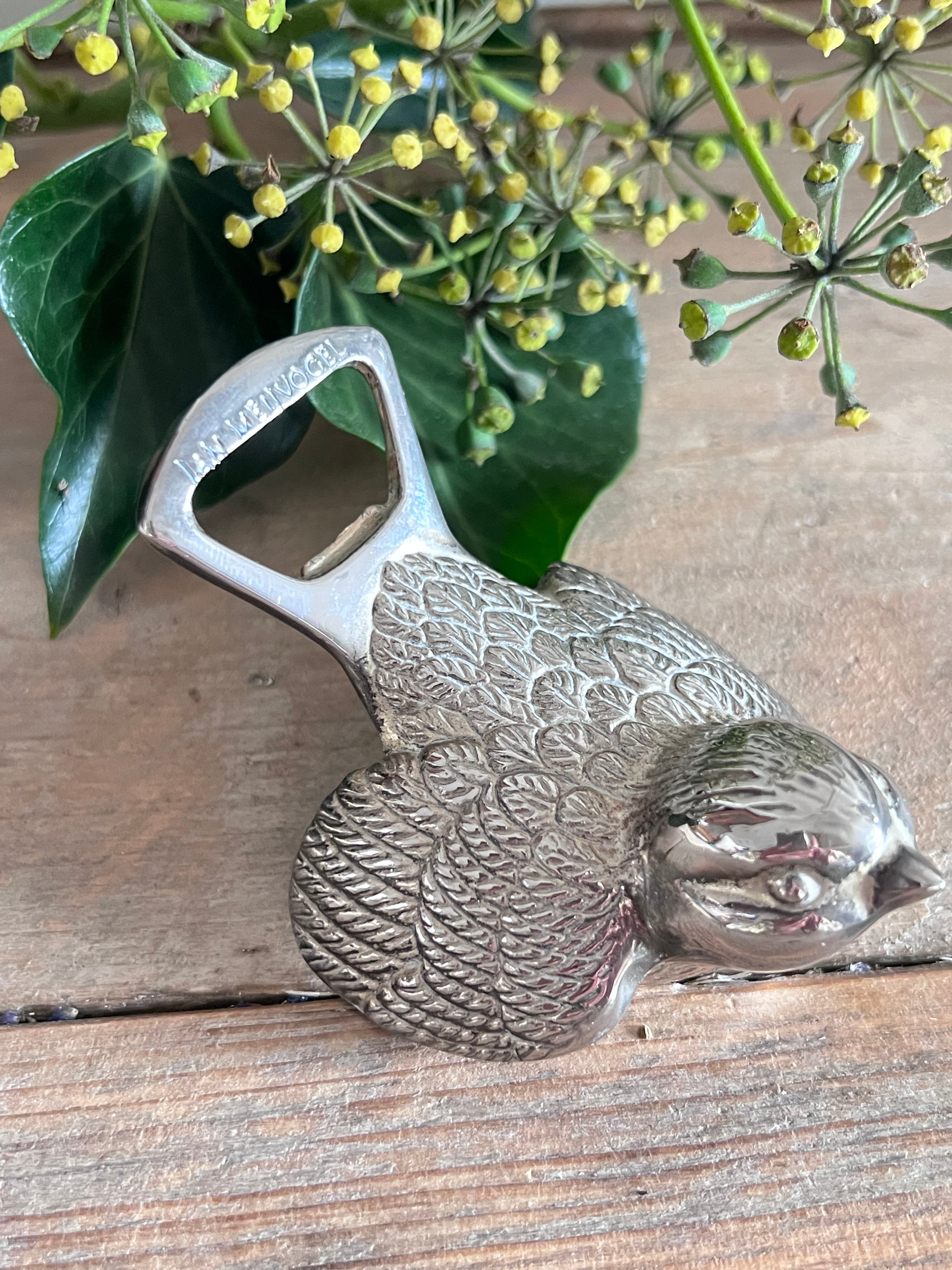 Jam Meuvogel flesopener, zilverkleurige flesopener, vintage flesopener, retro flesopener, metalen flesopener, flesopener vintage stijl, unieke flesopener, Jam Meuvogel opener.